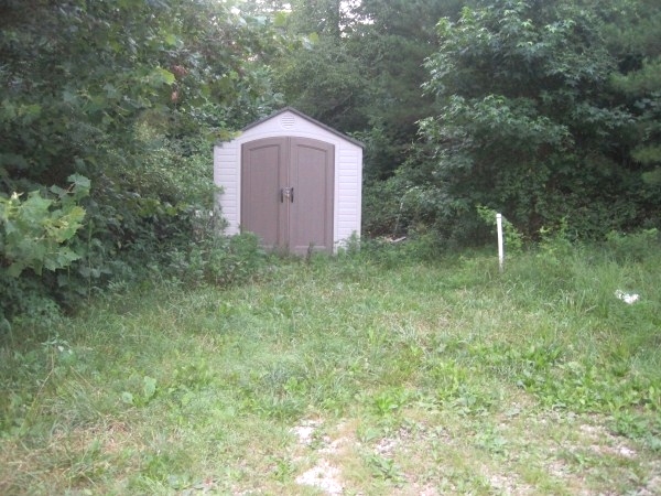 SOLD!  Finished basement and 2 + acres of land all at $14,000. 