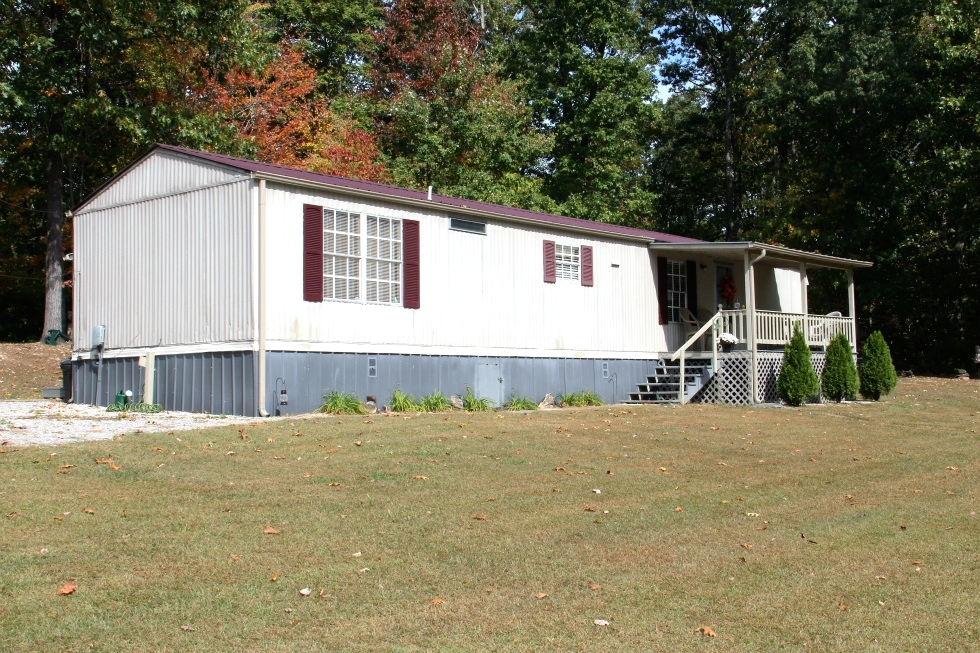 Sold!  10 wooded acres, 3 bedroom home with over 2500 sf of living space and a 16 X 60, 1996 Fleetwood mobile home 